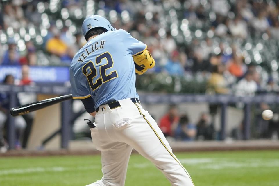 Milwaukee Brewers' Christian Yelich hits a double during the eighth inning of a baseball game against the Toronto Blue Jays Tuesday, June 11, 2024, in Milwaukee. (AP Photo/Morry Gash)