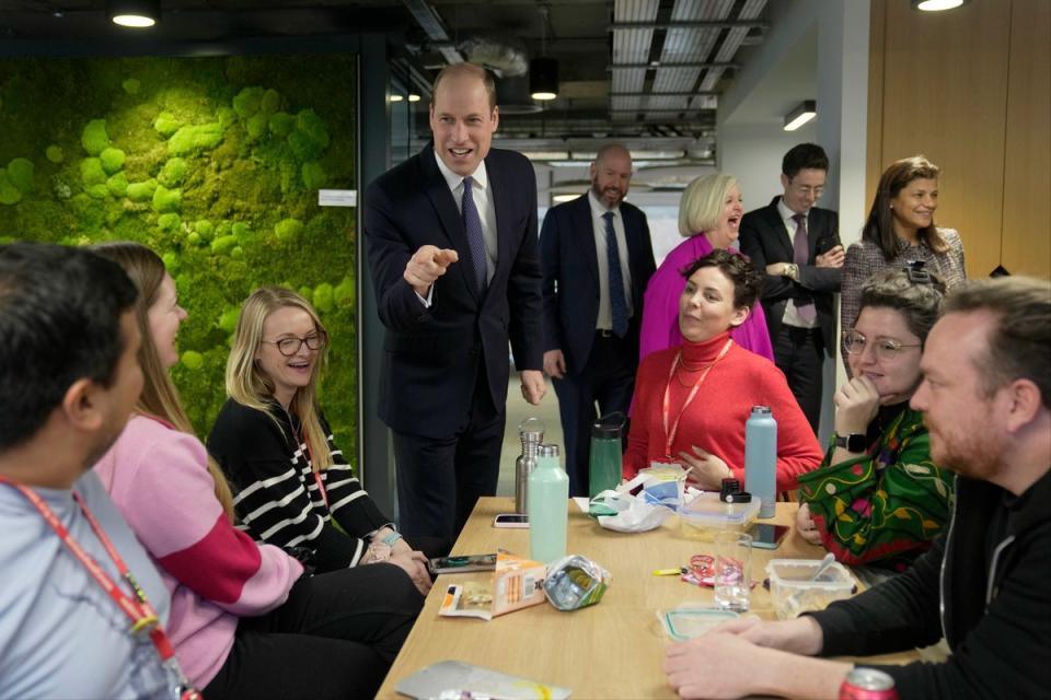 Prince William talks to employees as he visits the British Red Cross (AP)