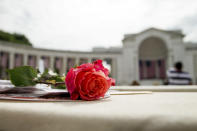 <p>A rose is left on a seat before President Barack speaks at the Memorial Amphitheater of Arlington National Cemetery on Monday, May 30, 2016, during a Memorial Day ceremony. (Photo: Andrew Harnik/AP) </p>