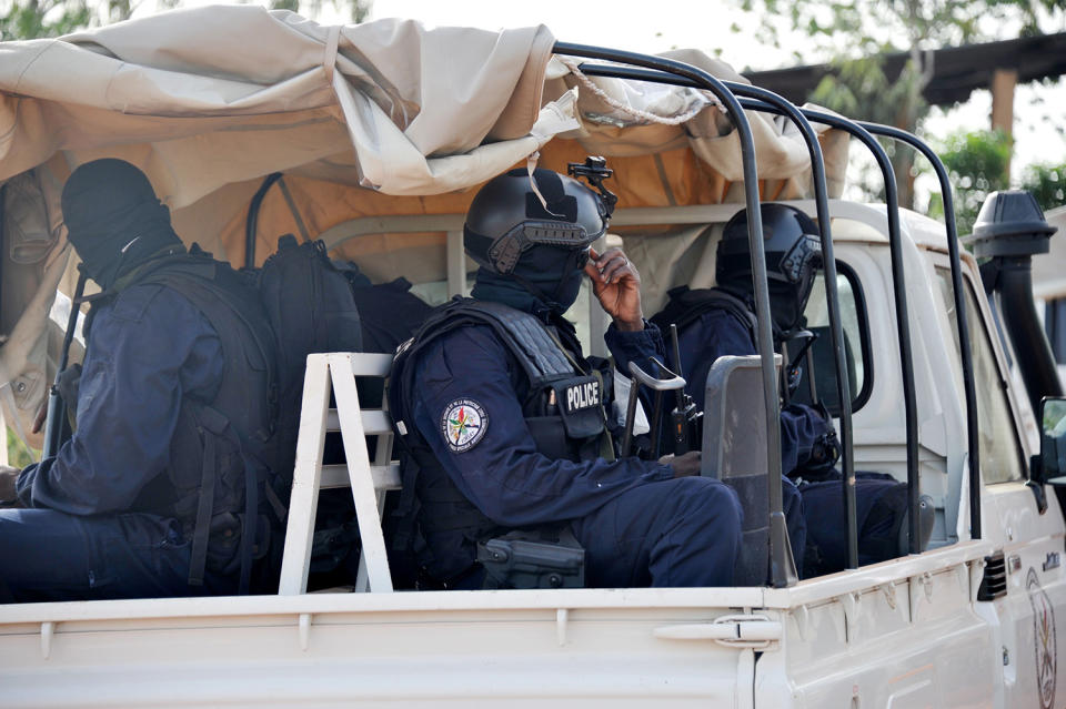 <p>Malian police forces enter the Kangaba tourist resort in Bamako on June 19, 2017, a day after suspected jihadists stormed the resort, briefly seizing more than 30 hostages and leaving at least two people dead. (Habibou Kouyate/AFP/Getty Images) </p>