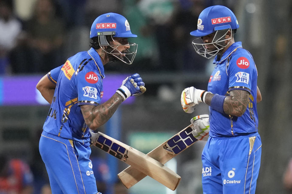 Mumbai Indians' Suryakumar Yadav, right, celebrates scoring fifty runs with Tilak Varma during the Indian Premier League cricket match between Mumbai Indians and Sunrisers Hyderabad in Mumbai, India, Monday, May 6, 2024. (AP Photo/Rajanish Kakade)