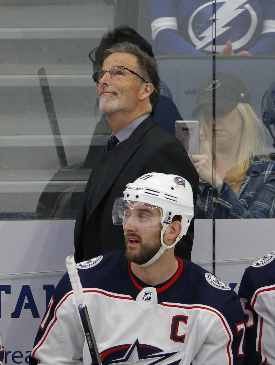 Columbus Blue Jackets head coach John Tortorella looks to the scoreboard behind left wing Nick Foligno (71) during the second period of the NHL Stanley Cup Playoffs first round series against the Tampa Bay Lightning at Amalie Arena in Tampa, Florida on April 10, 2019. [Adam Cairns/Dispatch]