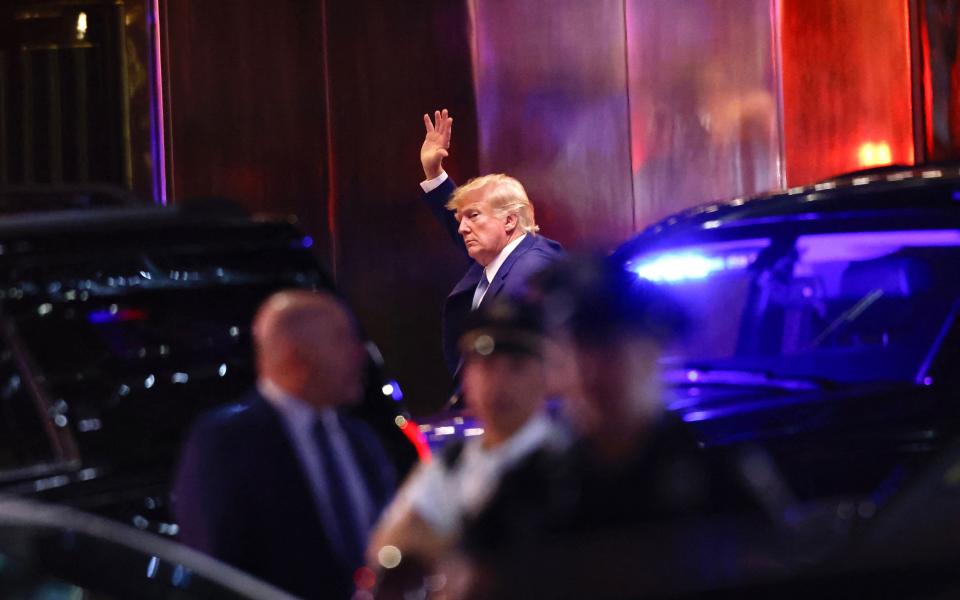 Former US president Donald Trump arrives at Trump Tower in New York on 12 April 2023 (AFP via Getty Images)