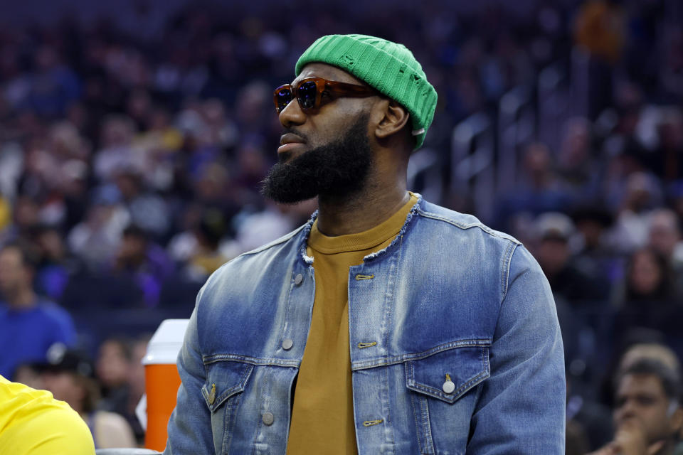 Los Angeles Lakers forward LeBron James (6) watches from the bench during the first half of an NBA basketball game against the Golden State Warriors in San Francisco, Saturday, Feb. 11, 2023. (AP Photo/Jed Jacobsohn)