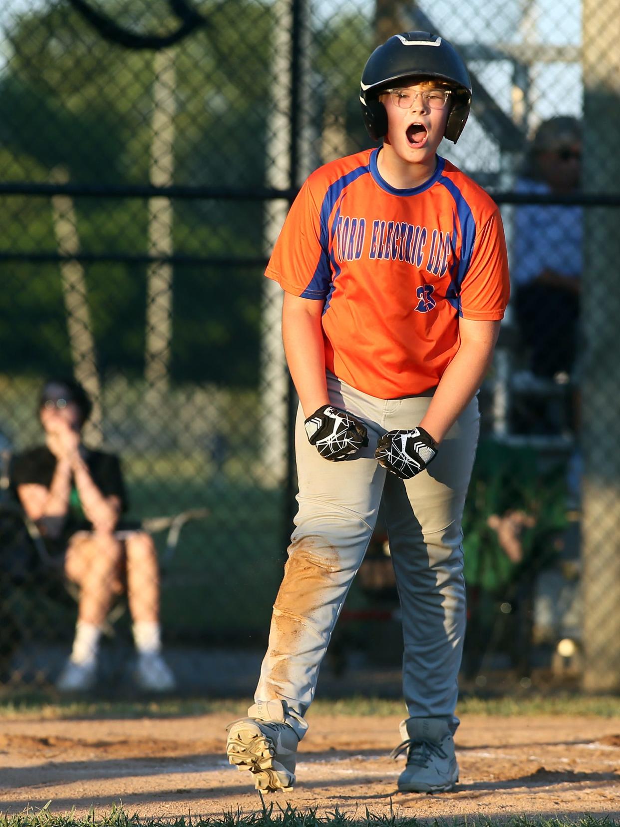 Heath's Ford Electric's Gavyn DiBlasio celebrates scoring during the team's 9-1 loss to Northridge's Hands and Feet Movement during the Licking County Shrine Tournament Varsity Division final at Mound City on Thursday, June 27, 2024.