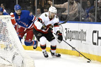 Ottawa Senators left wing Jiri Smejkal (13) skates with the puck as he is pursued by New York Rangers defenseman K'Andre Miller (79) during the first period of an NHL hockey game Monday, April 15, 2024, at Madison Square Garden in New York. (AP Photo/Bill Kostroun)
