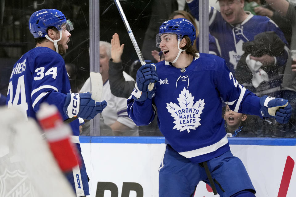 Toronto Maple Leafs left wing Matthew Knies (23) celebrates his goal with teammate Auston Matthews (34) during the second period of Game 1 of an NHL hockey Stanley Cup second-round playoff series against the Florida Panthers in Toronto, Tuesday, May 2, 2023. (Frank Gunn/The Canadian Press via AP)