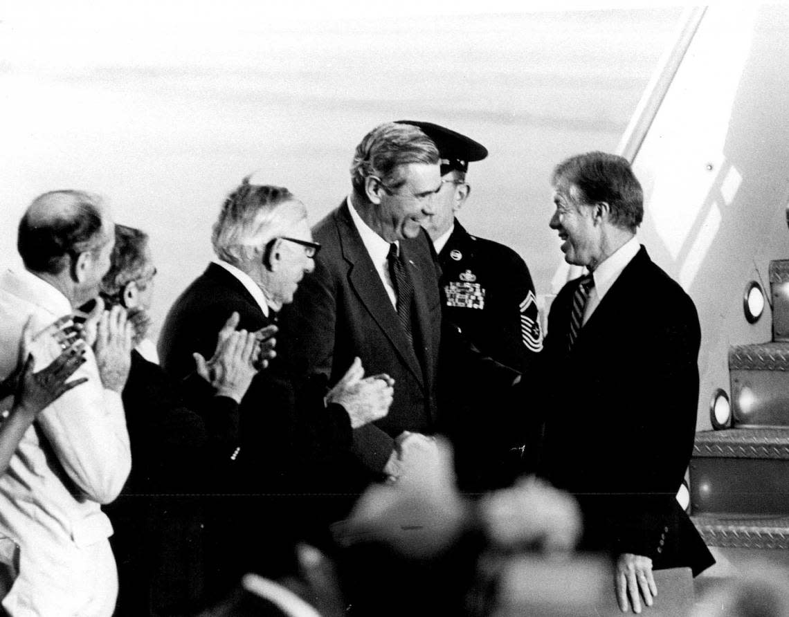 U.S. Rep. Claude Pepper and former Florida Gov. Reubin Askew welcome President Jimmy Carter to South Florida.