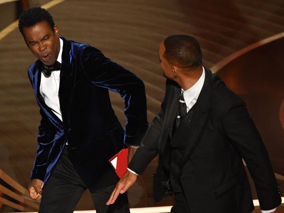 US actor Will Smith (R) slaps US actor Chris Rock onstage during the 94th Oscars at the Dolby Theatre in Hollywood, California on March 27, 2022.