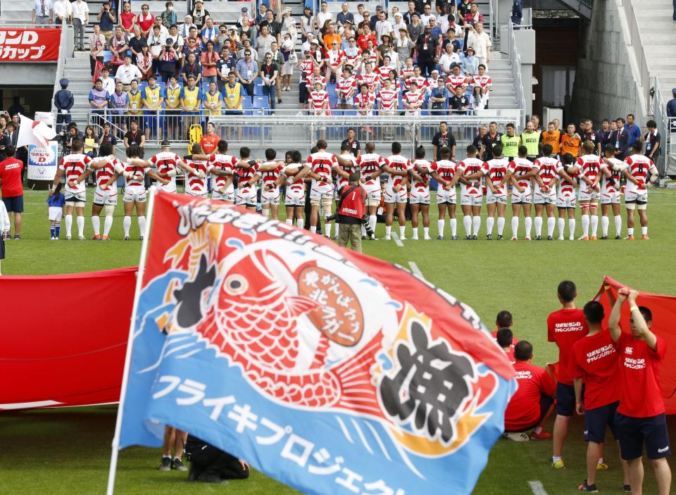 Japan's players sings national anthem before their Pacific Nations Cup rugby match against Fiji at Kamaishi Recovery Memorial Stadium in Kamaishi, northern Japan, Saturday, July 27, 2019. Japan took big step forward in Rugby World Cup preparation with a five-try 34-21 win over Fiji in Pacific Nations Cup (Yusuke Ogata/Kyodo News via AP)