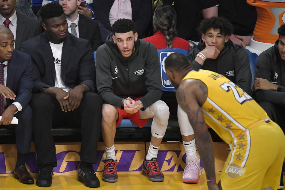 Los Angeles Lakers forward LeBron James, right, talks with New Orleans Pelicans forward Zion Williamson, left, and guard Lonzo Ball during the second half of an NBA basketball game Friday, Jan. 3, 2020, in Los Angeles. The Lakers won 123-113. (AP Photo/Mark J. Terrill)