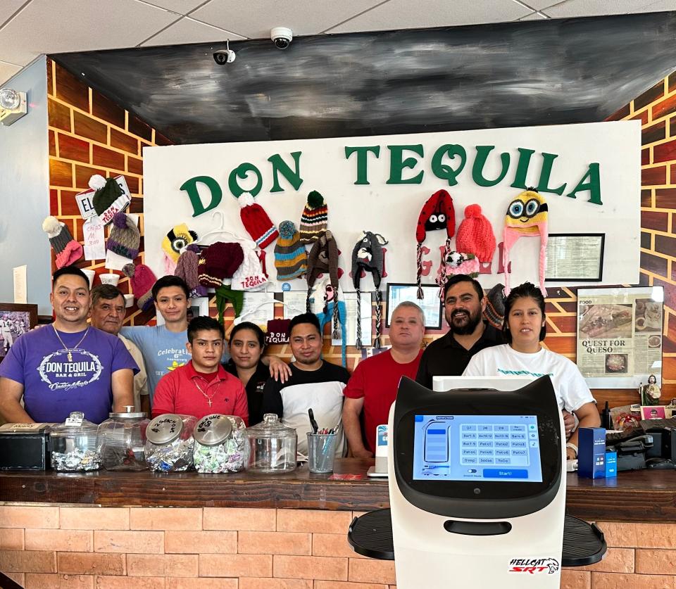 Bella with her Don Tequila family, from left, Angel, Basillo, Alex, Marvin, Elvira, Ismael, Pedro, Feliciano and Maria.