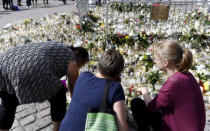 Mourners bring memorial cards, candles and flowers to the Turku Market Square, in Turku, Finland August 20, 2017. Lehtikuva/Vesa Moilanen