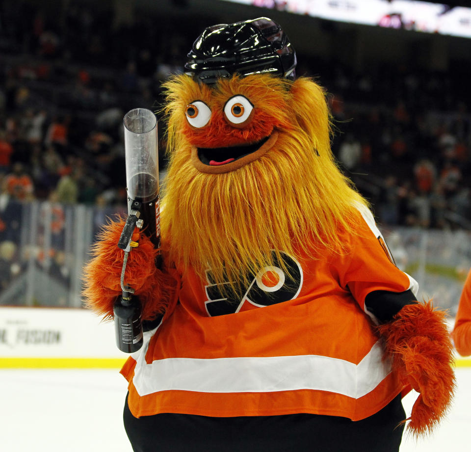 The Philadelphia Flyers mascot, Gritty, takes to the ice during the first intermission of the Flyers' preseason NHL hockey game against the Boston Bruins, Monday, Sept, 24, 2018, in Philadelphia. (AP Photo/Tom Mihalek)