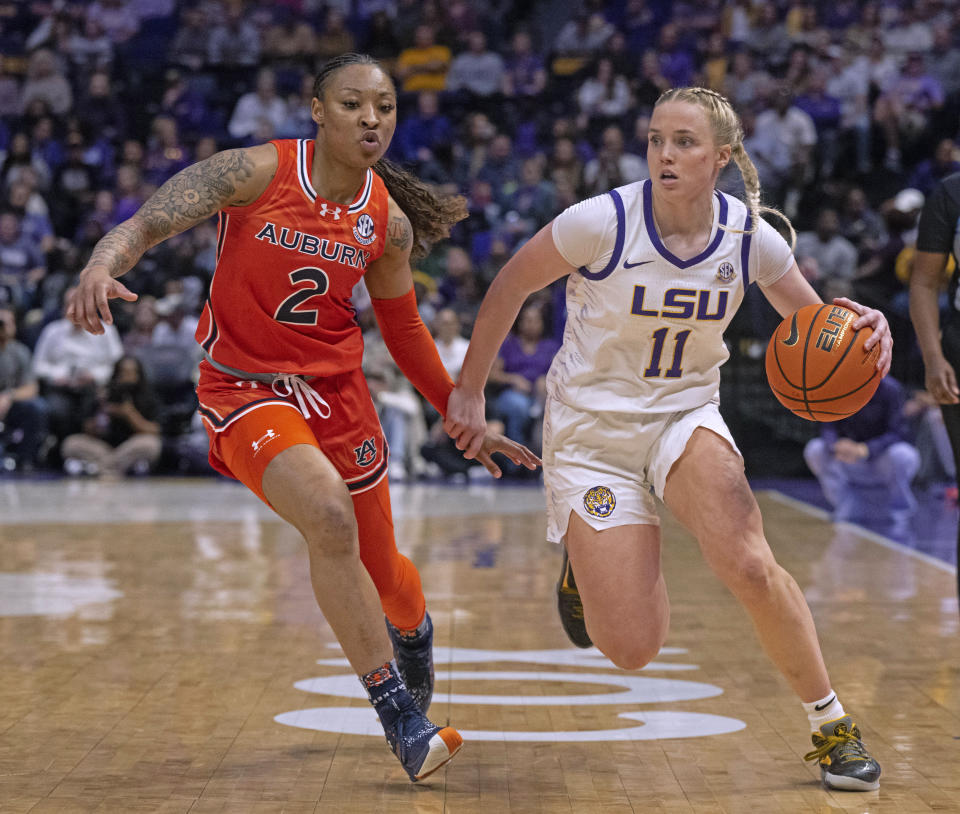 LSU guard Hailey Van Lith (11) drives against Auburn guard Jamya Mingo-Young (2) during an NCAA college basketball game Thursday, Feb. 22, 2024, in Baton Rouge, La. (Hilary Scheinuk/The Advocate via AP)