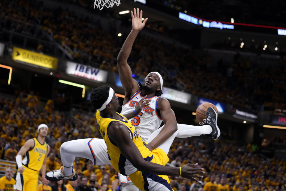 Indiana Pacers forward Pascal Siakam blocks a shot by New York Knicks forward Precious Achiuwa (5) during the first half of Game 3 in an NBA basketball second-round playoff series, Friday, May 10, 2024, in Indianapolis. (AP Photo/Michael Conroy)