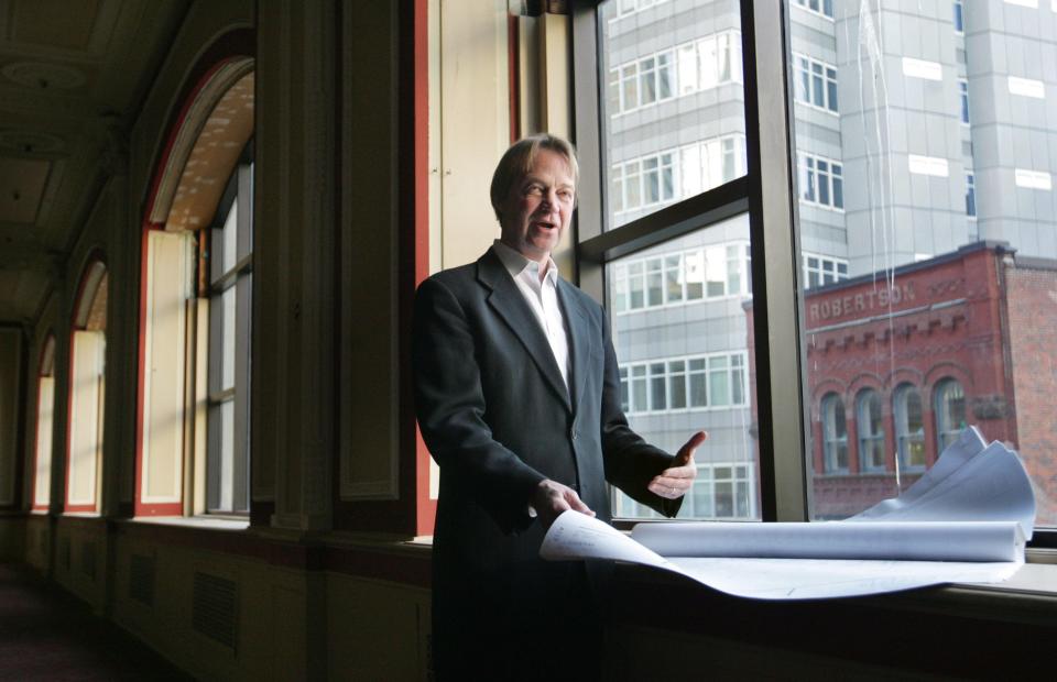 Architect Kirck Blunck is working with Virginia developer Michael Alexander to turn the old Younkers building into housing and retail space. He is shown with his renovation drawings inside the old Tea Room in 2009.