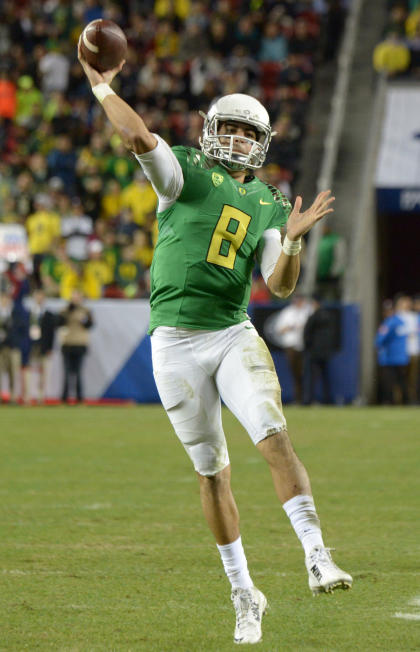 Dec 5, 2014; Santa Clara, CA, USA; Oregon Ducks quarterback Marcus Mariota (8) throws a pass against the Arizona Wildcats in the Pac-12 Championship at Levi's Stadium. The Ducks won 51-13. (Kirby Lee-USA TODAY Sports)