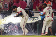 Los Angeles Angels' Luis Rengifo, right, tosses liquid at starting pitcher Shohei Ohtani after a baseball game against the Oakland Athletics Thursday, Sept. 29, 2022, in Anaheim, Calif. (AP Photo/Mark J. Terrill)