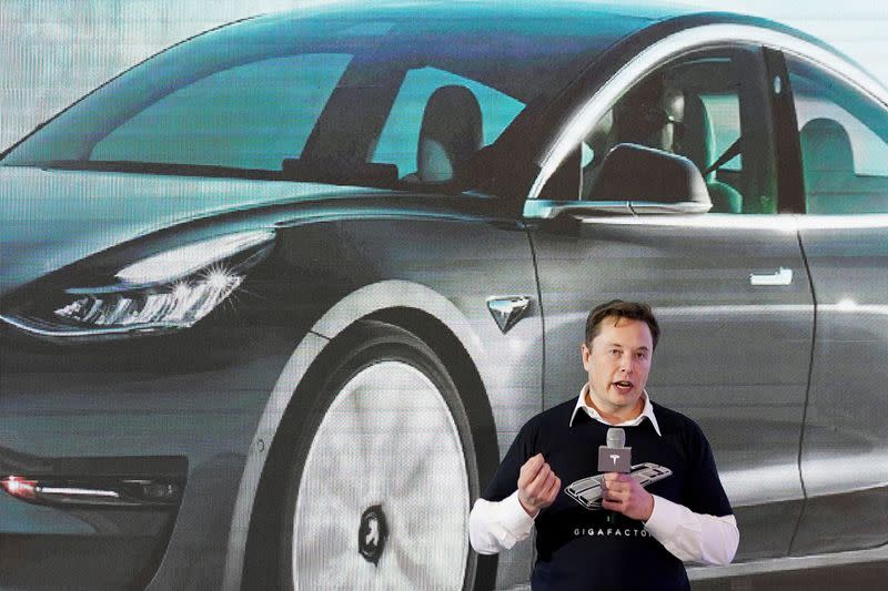 FILE PHOTO: Tesla Inc CEO Elon Musk speaks onstage during a delivery event for Tesla China-made Model 3 cars at its factory in Shanghai