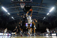 Villanova's Jermaine Samuels (23) goes up for a shot against Pennsylvania's Jonah Charles (2) during the first half of an NCAA college basketball game, Wednesday, Dec. 1, 2021, in Philadelphia. (AP Photo/Matt Slocum)