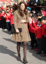 Kate wears a $257 shirt dress by Irish designer Orla Kiely during her visit to the school on Feb. 21, 2012. Inside the classroom, Kate wore an apron that read "Miss Catherine" on the front. Kate wears a lot of wearable outfits that could suit many women. This dress is modest but still fun with the buttons on the chest and the belt that shows off her waist. Paired with cute brown boots and you've got a great day look. (Photo by Chris Jackson/Getty Images)