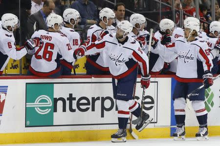 Mar 19, 2019; Newark, NJ, USA; Washington Capitals right wing Brett Connolly (10) celebrates with teammates after scoring a goal against the New Jersey Devils during the second period at Prudential Center. Mandatory Credit: Noah K. Murray-USA TODAY Sports