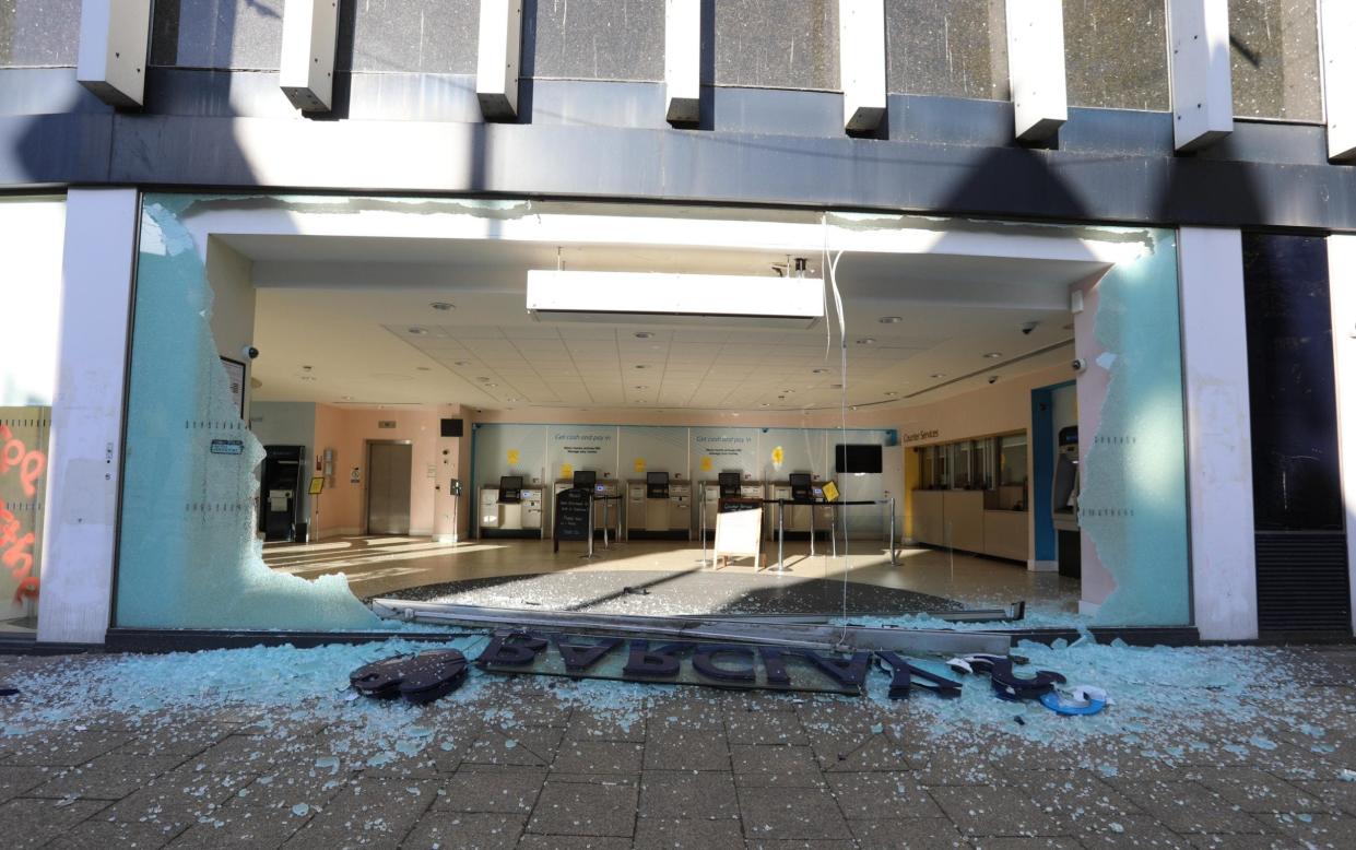 The window of the Barclays Branch was smashed in as well as graffiti sprayed on the building