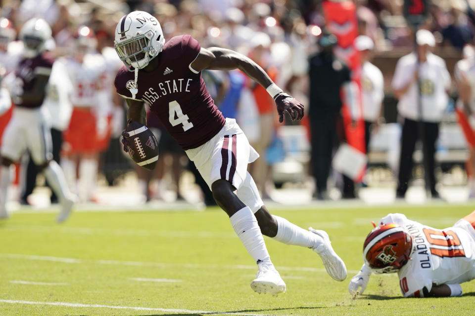 Mississippi State wide receiver Caleb Ducking (4) runs away from an attempted tackle by Bowling Green cornerback Jordan Oladokun (10) on his way to a 26-yard touchdown during the first half of an NCAA college football game in Starkville, Miss., Saturday, Sept. 24, 2022. (AP Photo/Rogelio V. Solis)
