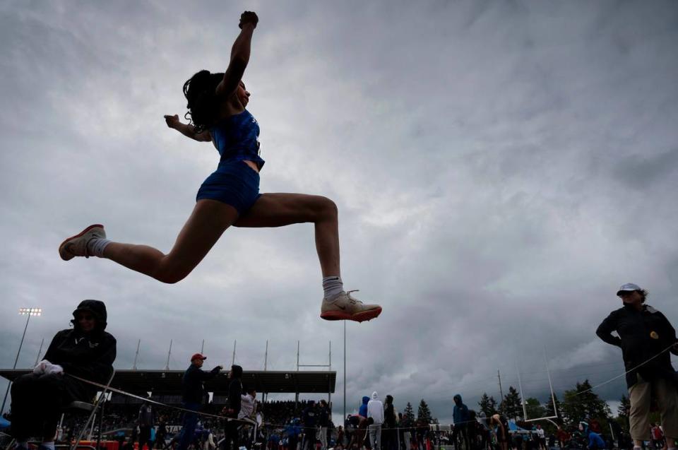Federal Way’s Cassandra Atkins flies through the air en route to a second-place finish in the 4A girls long jump competition during the second day of the WIAA State Track and Field Championships at Mount Tahoma High School in Tacoma, Washington on Friday, May 27, 2022.