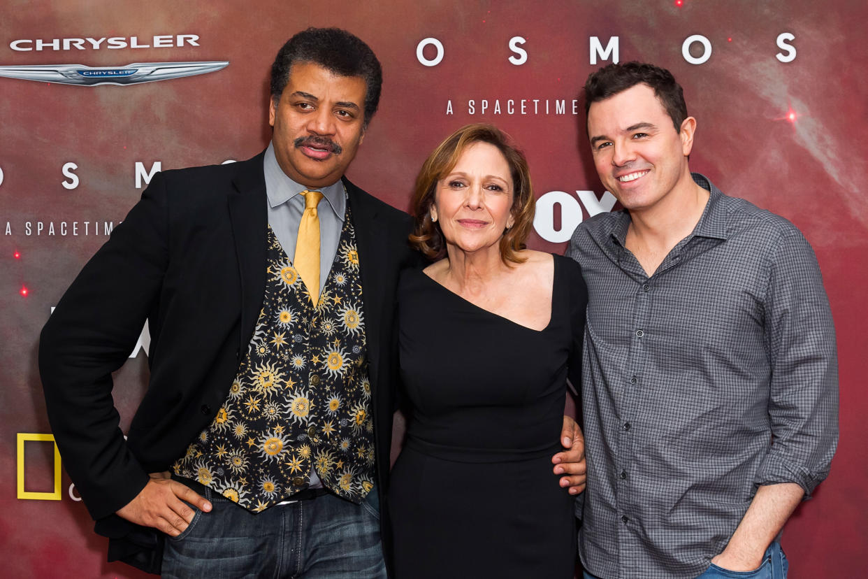 (L-R) Astrophysicist Neil deGrasse Tyson, director Ann Druyan and actor Seth MacFarlane attend the premiere of Fox's 'Cosmos: A SpaceTime Odyssey' on March 4, 2014 in Los Angeles.