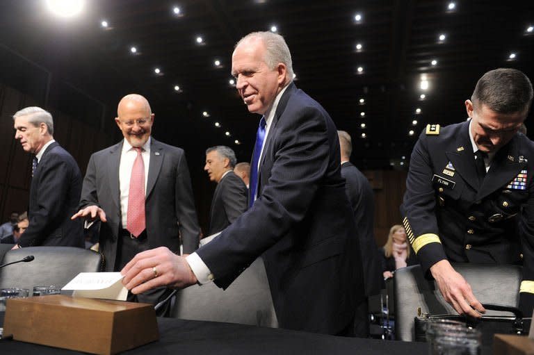 CIA Director John Brennan (2ndL), Director of National Intelligence James Clapper (2ndR), FBI Director Robert Mueller (R) and Defense Intelligence Agency Director Lt. Gen. Michael Flynn (R) arrive to testify in Washington, DC, March 12, 2013. Iran could not produce enough highly-enriched uranium for an atomic bomb without being detected, Clapper said