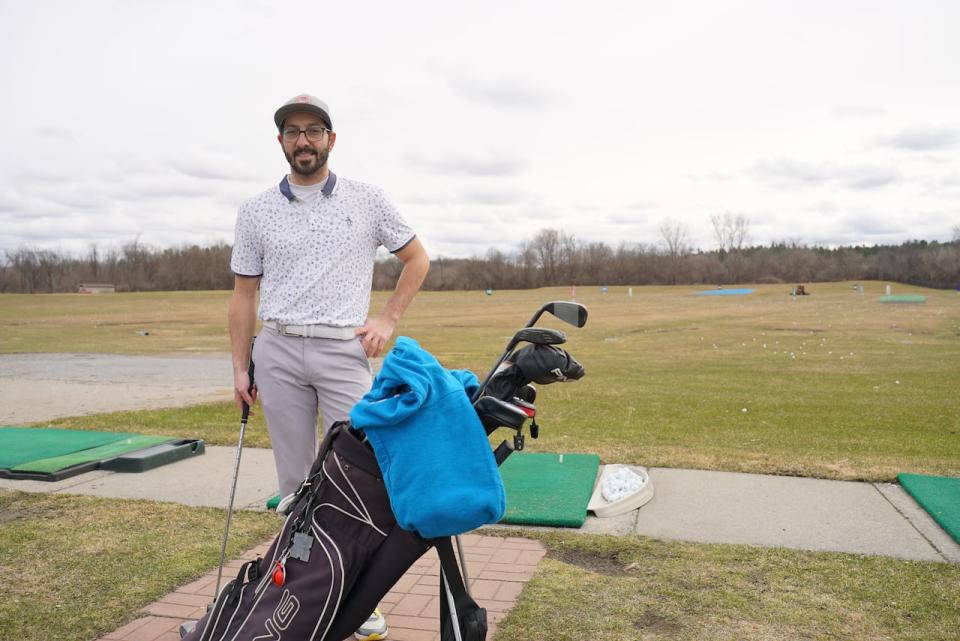 Local golfer James Drolet hit the driving range on Saturday. It was his first time out for the year, and he said he's looking forward to hitting the course for real. (Sam Konnert/CBC - image credit)