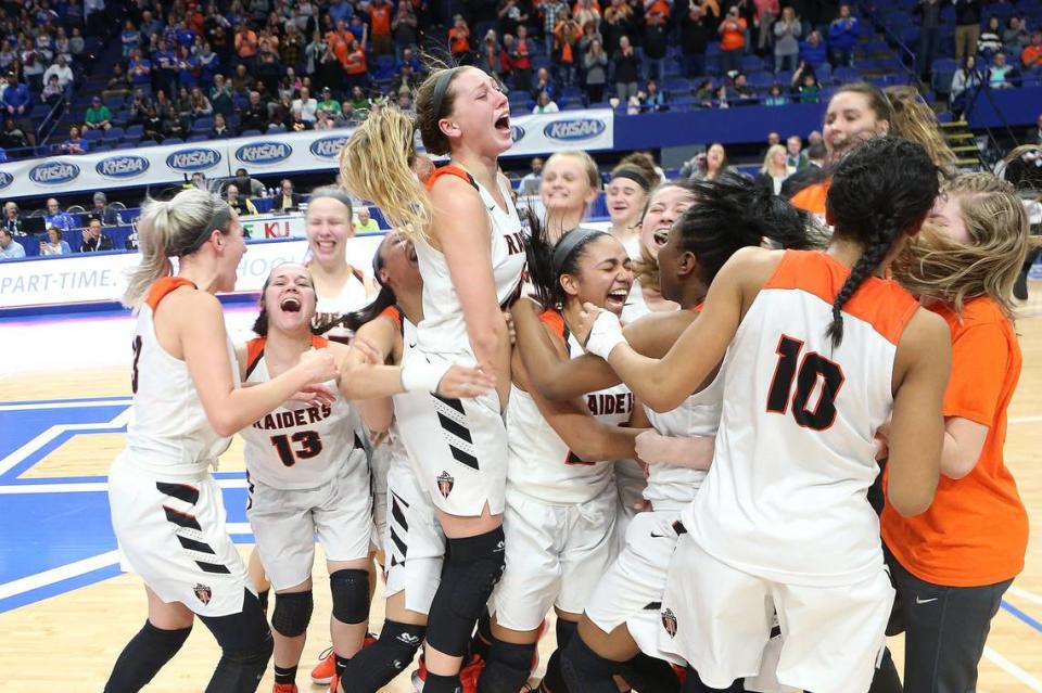 Ryle’s Maddie Scherr and the Lady Raiders celebrated after the beat Southwestern 63-48 at Rupp Arena in the 2019 Kentucky Girls State Tournament championship game.