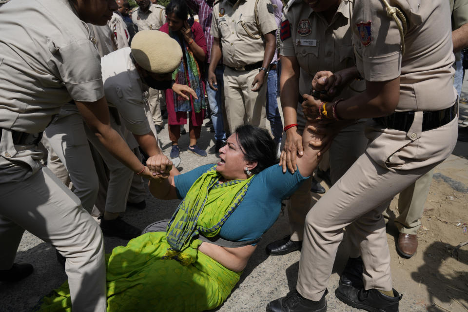 Policemen detain a member of Aam Admi Party, or Common Man's Party, during a protest against the arrest of their party leader Arvind Kejriwal in New Delhi, India, Tuesday, March 26, 2024. Indian police have detained dozens of opposition protesters and prevented them from marching to Prime Minister Narendra Modi’s residence to demand the release of their leader and top elected official of New Delhi who was arrested last week in a liquor bribery case. (AP Photo/Manish Swarup)