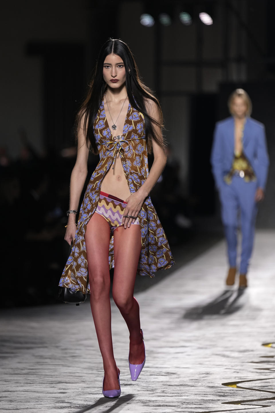 A model wears a creation as part of the Versace Spring Summer 2025 collection, that was presented in Milan, Italy, Friday, Sept. 20, 2024. (AP Photo/Antonio Calanni)