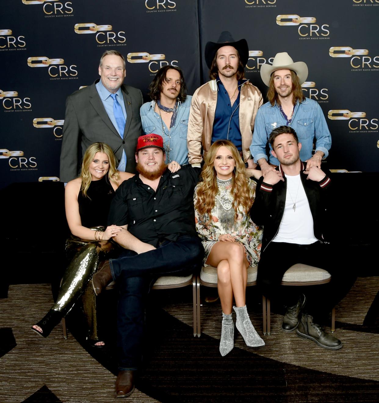Country Radio Broadcasters, Inc. Executive Director Bill Mayne celebrates with Cameron Duddy, Mark Wystrach and Jess Carson of Midland, Lauren Alaina, Luke Combs, Carly Pearce and Michael Ray at CRS 2018 on February 7, 2018, in Nashville, Tennessee.