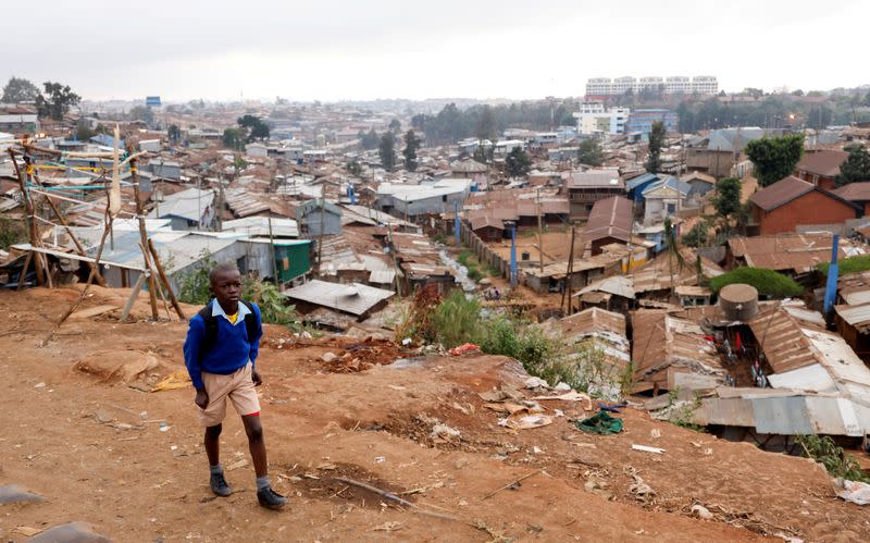 A schoolboy walks to school during the partial reopening of schools, in Nairobi