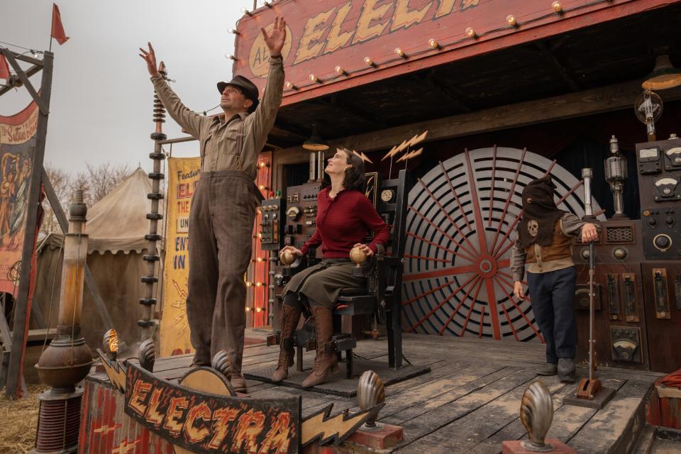 Bradley Cooper and Rooney Mara performing at a carnival