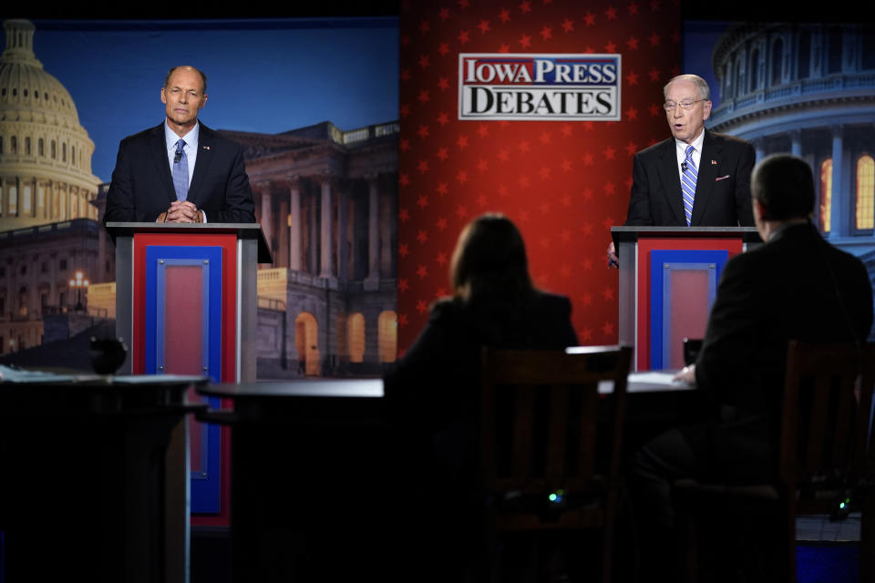 Iowa Democratic U.S. Senate candidate Mike Franken, left, and U.S. Sen. Chuck Grassley, R-Iowa, listen to a question during their debate, Thursday, Oct. 6, 2022, in Des Moines, Iowa. (AP Photo/Charlie Neibergall)