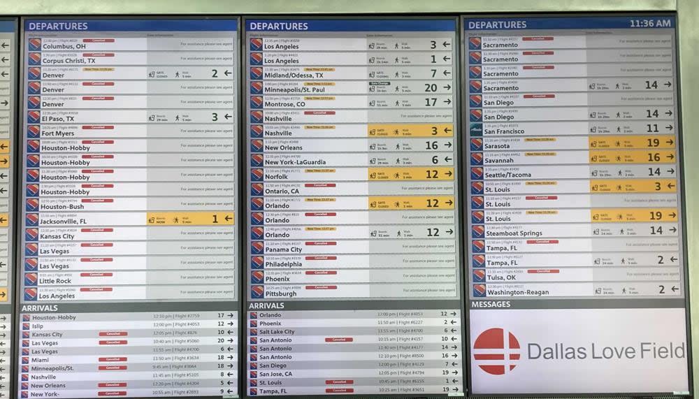 A flight information board shows cancellations for a number of Southwest Airlines flights, Sunday, Oct. 10, 2021, at Dallas Love Field. Southwest Airlines canceled hundreds of flights over the weekend, blaming the woes on air traffic control issues and weather. (AP Photo/Julie March)