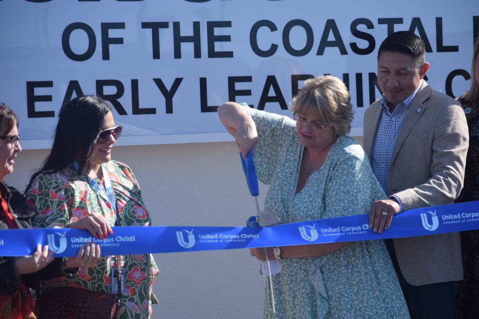 Kim Barrientos, president and CEO of Boys and Girls Clubs of the Coastal Bend, cuts the ribbon during a grand opening of the new facility on Thursday.