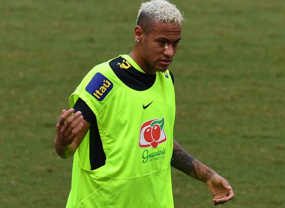 <p>Brazilian player Neymar is bothered by butterflies during a training for their September 6 FIFA World Cup Russia 2018 South American qualifier football match against Colombia, at Arena Amazonia stadium in Manaus, Brazil on September 3, 2016. / AFP / VANDERLEI ALMEIDA </p>