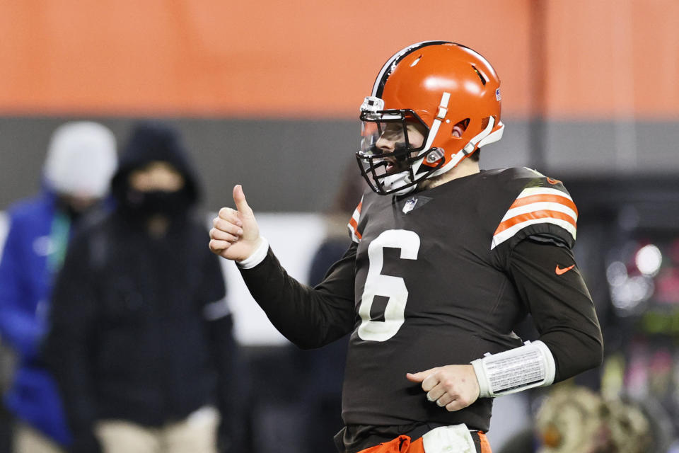 Cleveland Browns quarterback Baker Mayfield celebrates a 21-yard touchdown pass to wide receiver Rashard Higgins during the second half of an NFL football game against the Baltimore Ravens, Monday, Dec. 14, 2020, in Cleveland. (AP Photo/Ron Schwane)