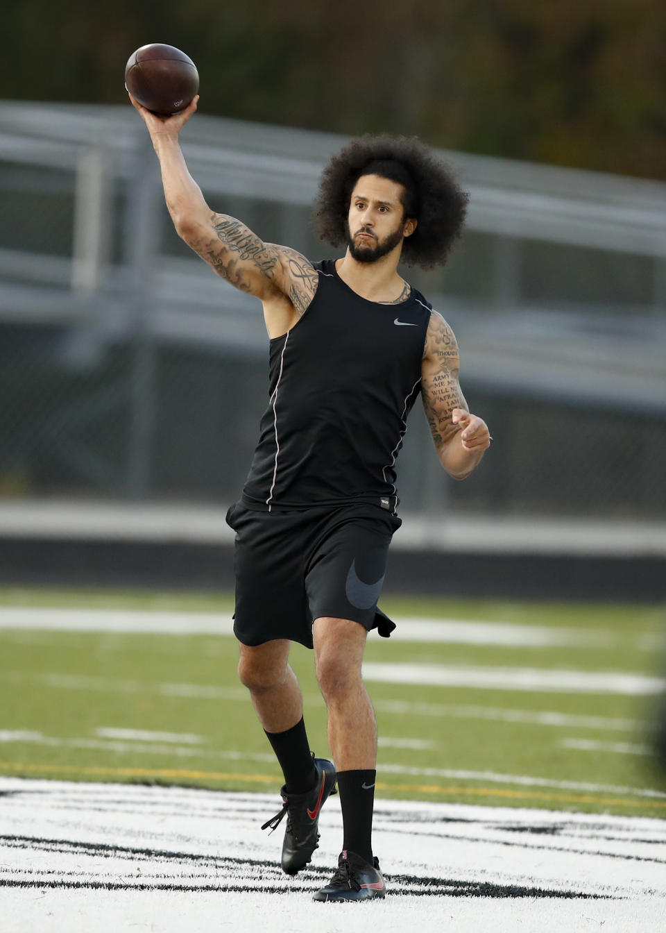 Free agent quarterback Colin Kaepernick participates in a workout for NFL football scouts and media, Saturday, Nov. 16, 2019, in Riverdale, Ga. (AP Photo/Todd Kirkland)