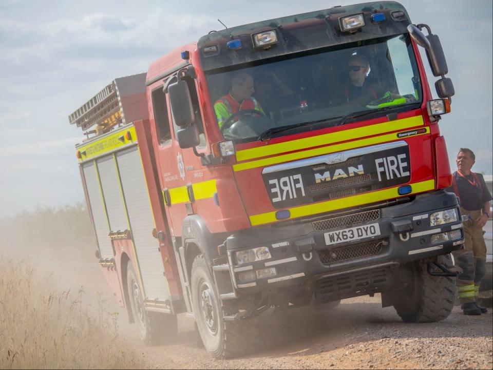 Paul Clement (right) says his crew has faced ‘two weeks of intense pressure’ leading up to fires in record-breaking heat (Dorset and Wiltshire Fire and Rescue Service)