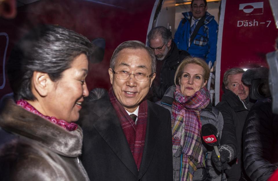 Greenland's Prime Minister Aleqa Hammond, left, talks with U.N. Secretary General Ban Ki-moon, center, and Danish Prime Minister Helle Thorning-Schmidt, third left, on the arrival, Tuesday, March 25, 2014 in Ilulissat in Greenland. The visit takes place in preparation for the U.N. Climate Summit on September this year in New York. (AP Photo/POLFOTO, Leiff Josefsen) DENMARK OUT