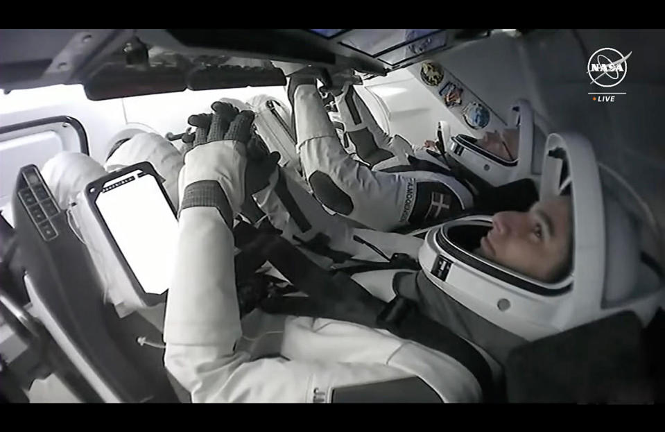 Crew 7 commander Jasmin Moghbeli monitors cockpit displays before the Crew Dragon Endurance de-orbited on March 12, 2024. / Credit: NASA/SpaceX