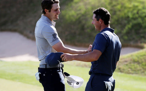 Peter Uihlein of the United States shakes hands with Rory McIlroy  - Credit: Getty Images