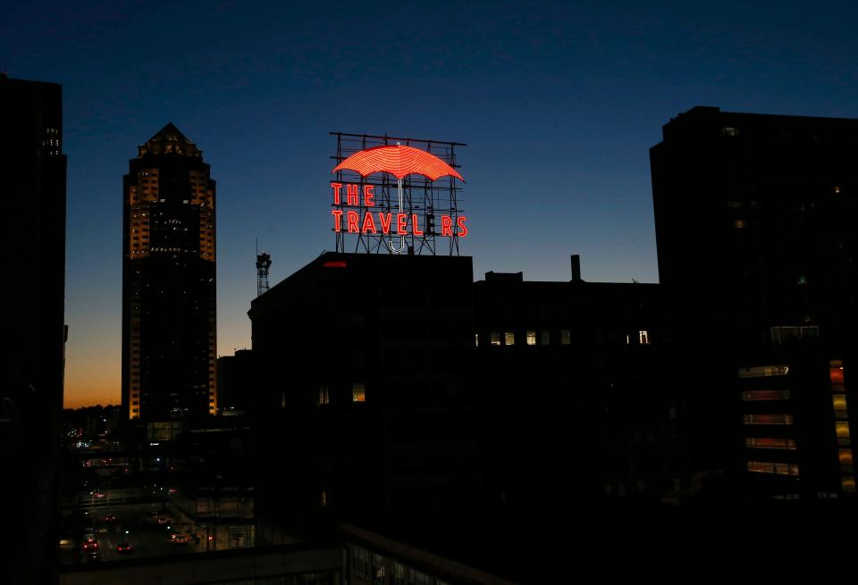 The Travelers Insurance sign, a popular fixture to the Des Moines skyline, shines bright over the east side of town on Wednesday, Sept. 8, 2021.